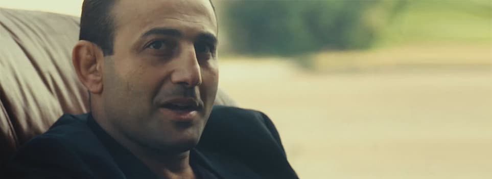 Roman Mitichyan seated in a car in a scene from Message from the King